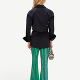 KABE SHOP INC Pia Poplin Pant in vibrant fruit punch green and blue stripes, worn with a black tailored shirt.