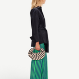 KABE SHOP INC Pia Poplin Pant in vibrant green and blue stripes, styled with a black shirt and woven crescent bag.