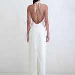 KABE SHOP INC Helia white halter gown with a plunging open back and floor-length silhouette on a model