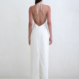 KABE SHOP INC Helia white halter gown with a plunging open back and floor-length silhouette on a model