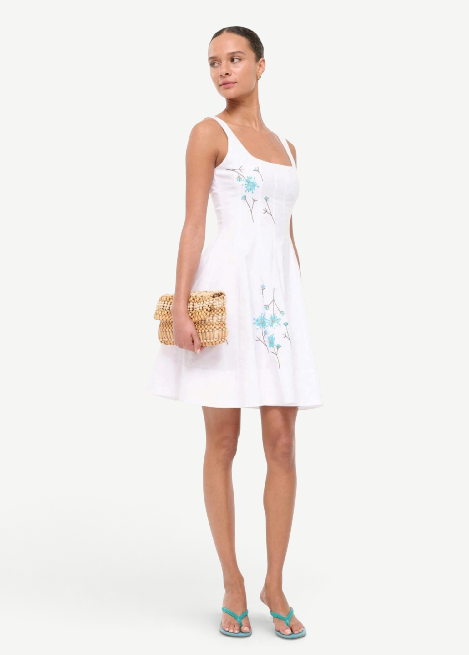 KABE SHOP INC Wells mini dress in white with blue floral embroidery, featuring a square neckline and flared skirt.