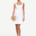 KABE SHOP INC Wells mini dress in white with blue floral embroidery, featuring a square neckline and flared skirt.