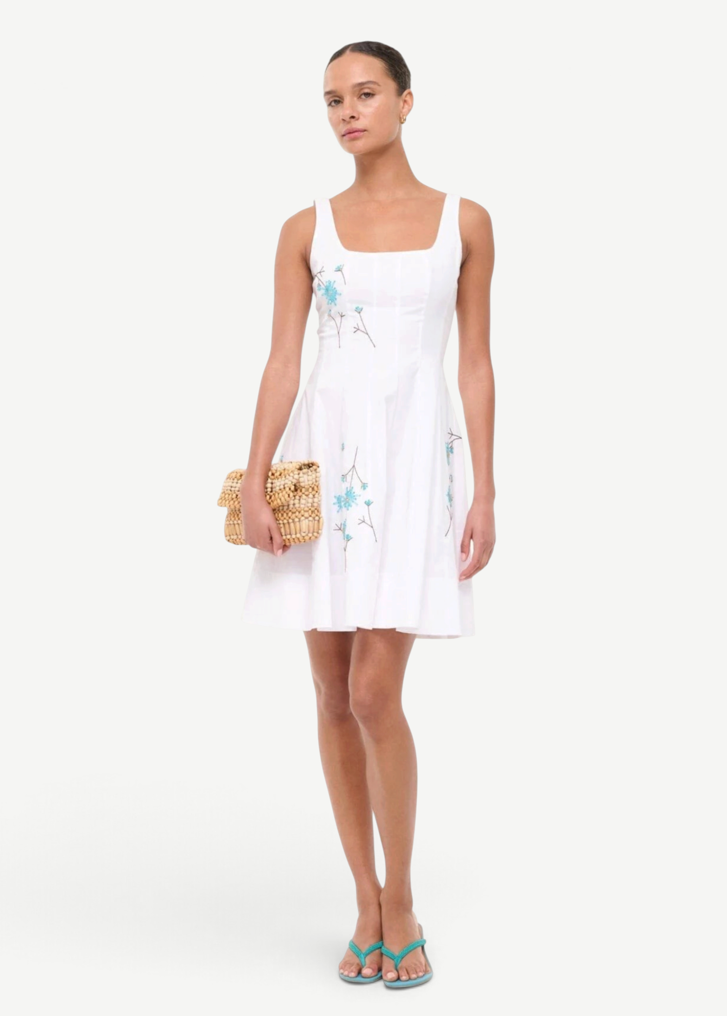KABE SHOP INC Wells mini dress in white with blue floral embroidery, featuring a square neckline and flared skirt.