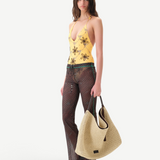 KABE SHOP INC Flo pants in sheer brown checkered fabric with lace-up waist and lettuce-edge hem on a model