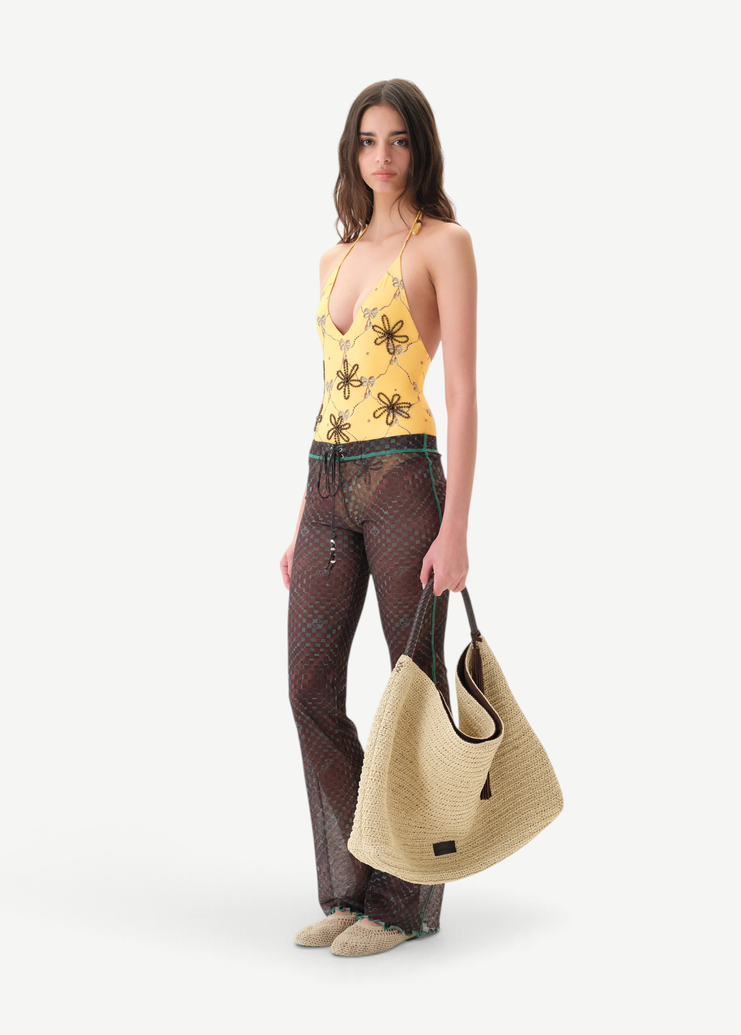 KABE SHOP INC Flo pants in sheer brown checkered fabric with lace-up waist and lettuce-edge hem on a model