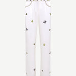 White pants with small colorful patterns on a white background
