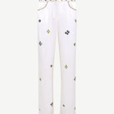 White pants with small colorful patterns on a white background