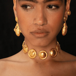 KABE SHOP INC Wasi choker featuring sculptural golden spheres inspired by Tayrona culture worn by a model