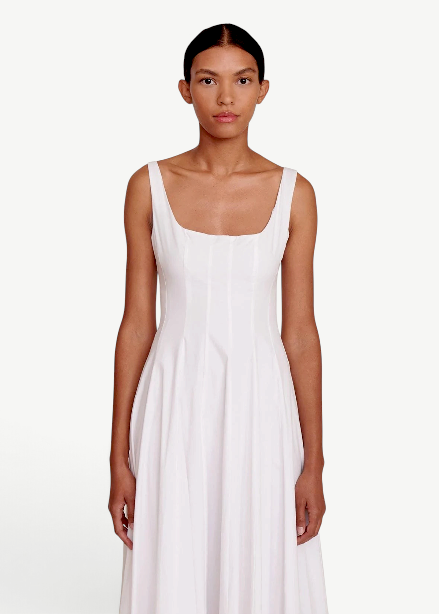 Model wearing a KABE SHOP INC white Wells dress with a square neckline and fitted bodice on a neutral background.