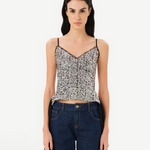 KABE SHOP INC Zaya top featuring silver sequin embellishments, adjustable straps, and sheer black tulle tie detail.