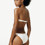 Model wearing KABE SHOP INC white Classic Bottom bikini swimwear with a versatile high or low hip silhouette
