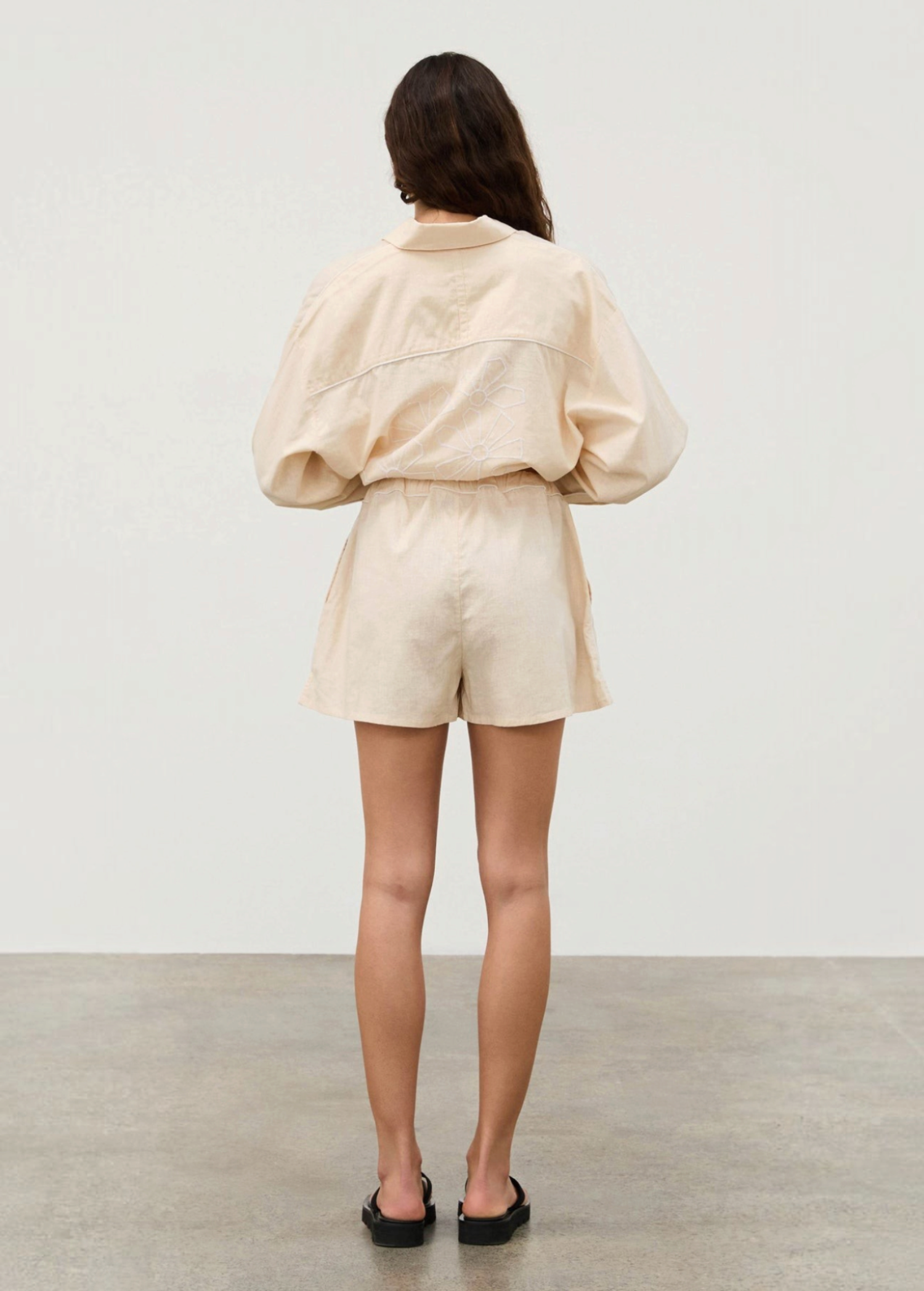 KABE SHOP INC Shea Hemp Blend cream shorts with elastic waistband and white piping, back view on a model.