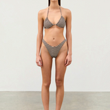 Model wearing KABE SHOP INC cocoa grid textured bikini set with a curved high-cut waist and moderate coverage.