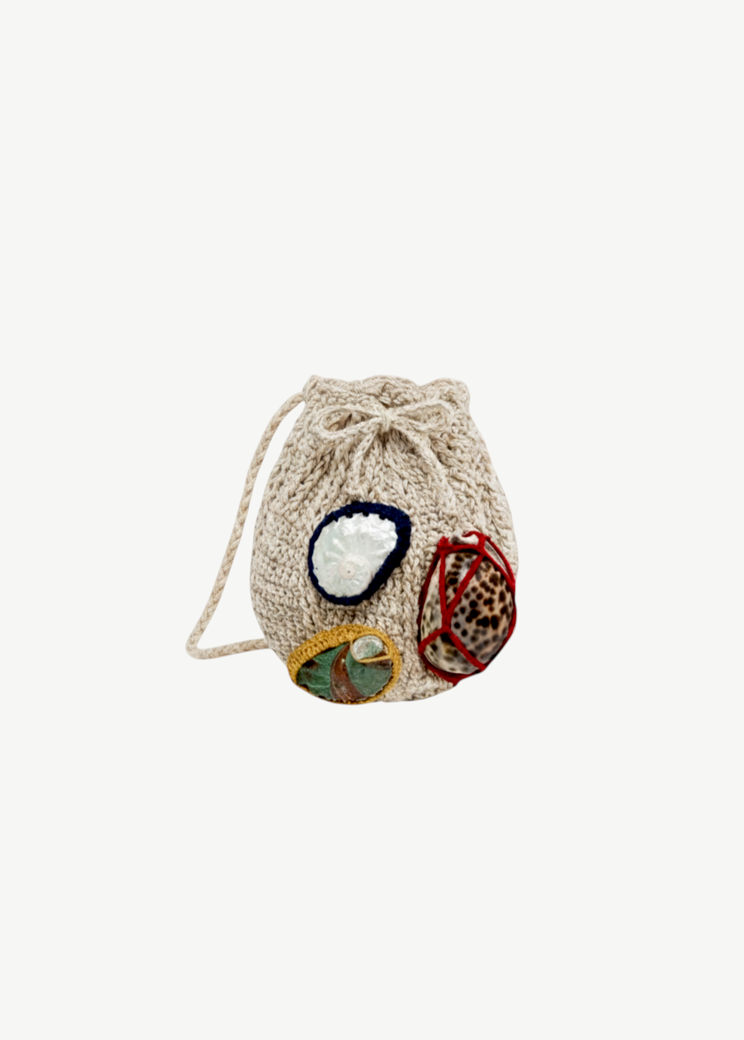 KABE SHOP INC Jali Bag in beige knit with decorative shell accents and a drawstring closure