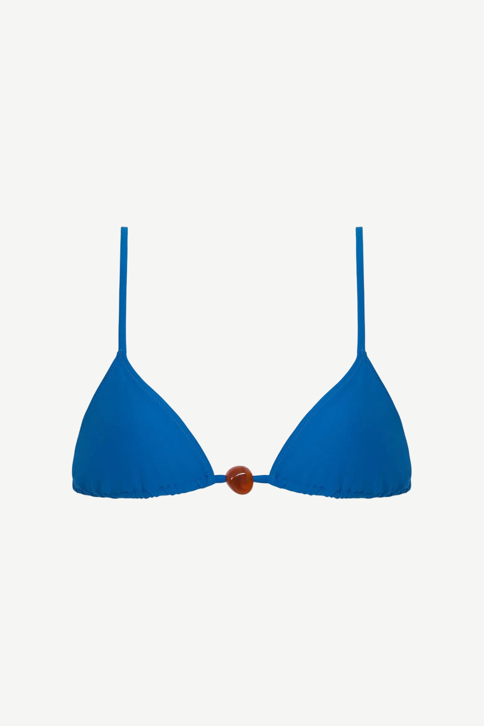 The Equator Top is a blue triangle bikini top featuring thin shoulder straps and a brown bead detail at the center, crafted from recycled polyamide for an eco-friendly swimwear option.