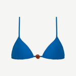 The Equator Top is a blue triangle bikini top featuring thin shoulder straps and a brown bead detail at the center, crafted from recycled polyamide for an eco-friendly swimwear option.