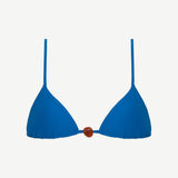 The Equator Top is a blue triangle bikini top featuring thin shoulder straps and a brown bead detail at the center, crafted from recycled polyamide for an eco-friendly swimwear option.