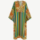 KABE SHOP INC Charlie midi dress in lightweight linen with a vibrant floral and striped pattern and deep V-neck.