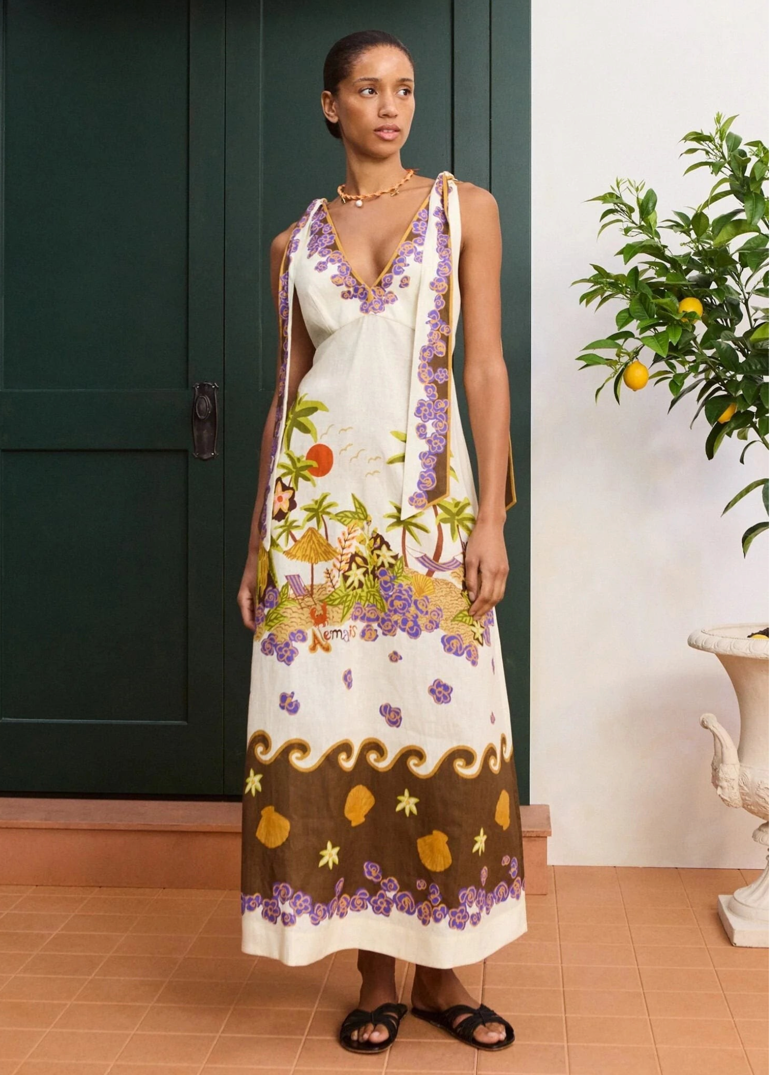 KABE SHOP INC Island Cove midi dress in white linen with tropical print, V-neckline, and adjustable shoulder ties.