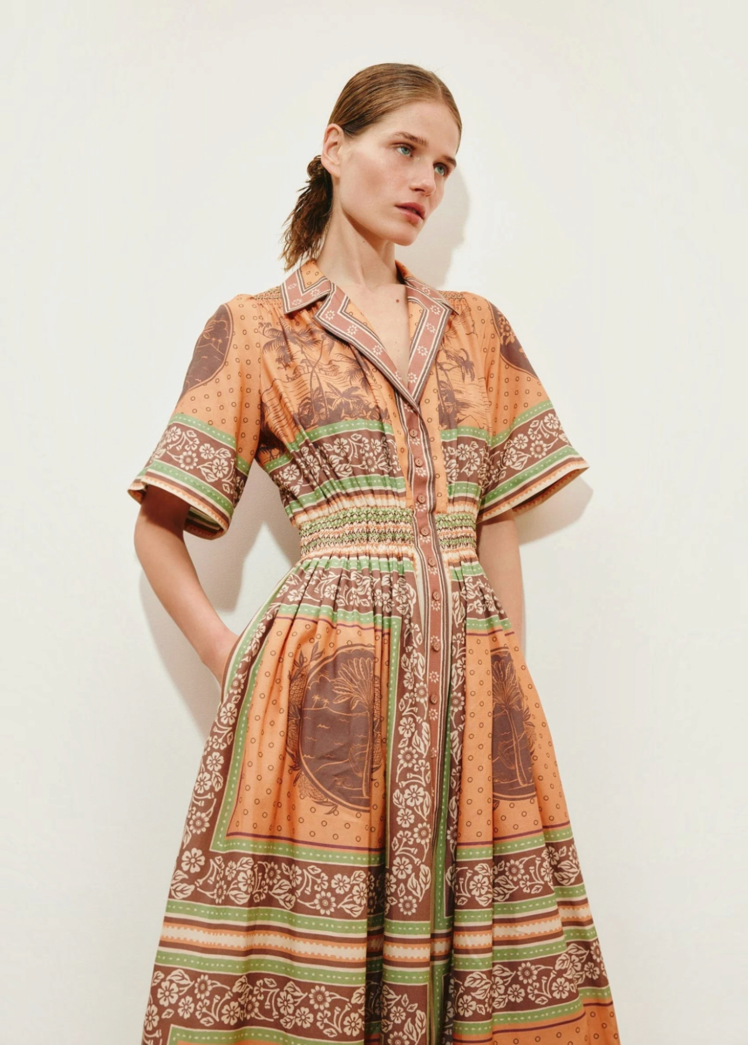 KABE SHOP INC Alberta midi shirtdress in peach with a vintage-inspired tropical print and cinched waist detail.