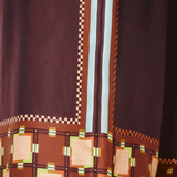 KABE SHOP INC Wilson pants featuring a dark brown fabric with a geometric checkerboard and square print pattern.