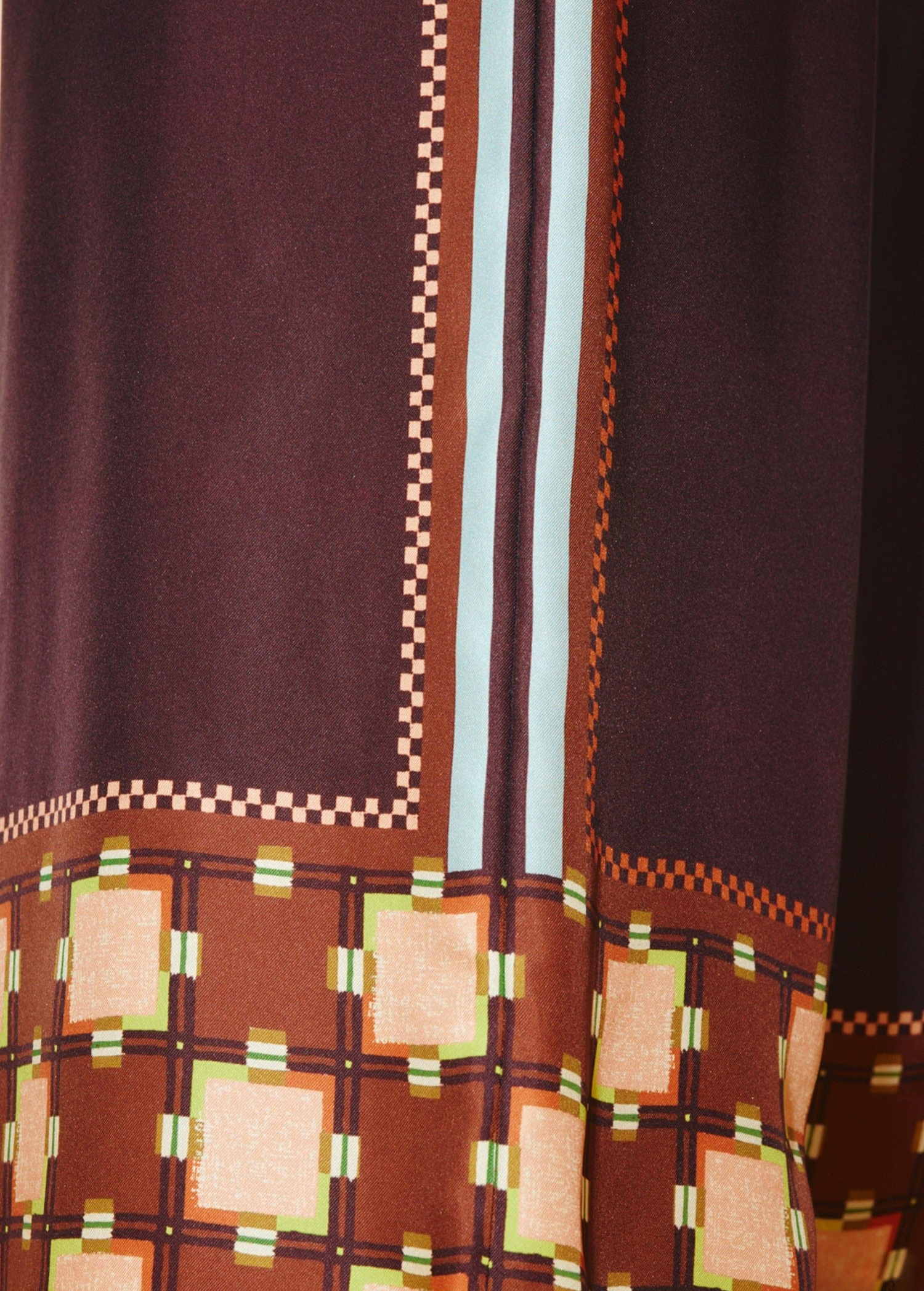 KABE SHOP INC Wilson pants featuring a dark brown fabric with a geometric checkerboard and square print pattern.