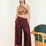 KABE SHOP INC Wilson relaxed jogger pants in deep burgundy with patterned hem detail worn with a matching scarf top
