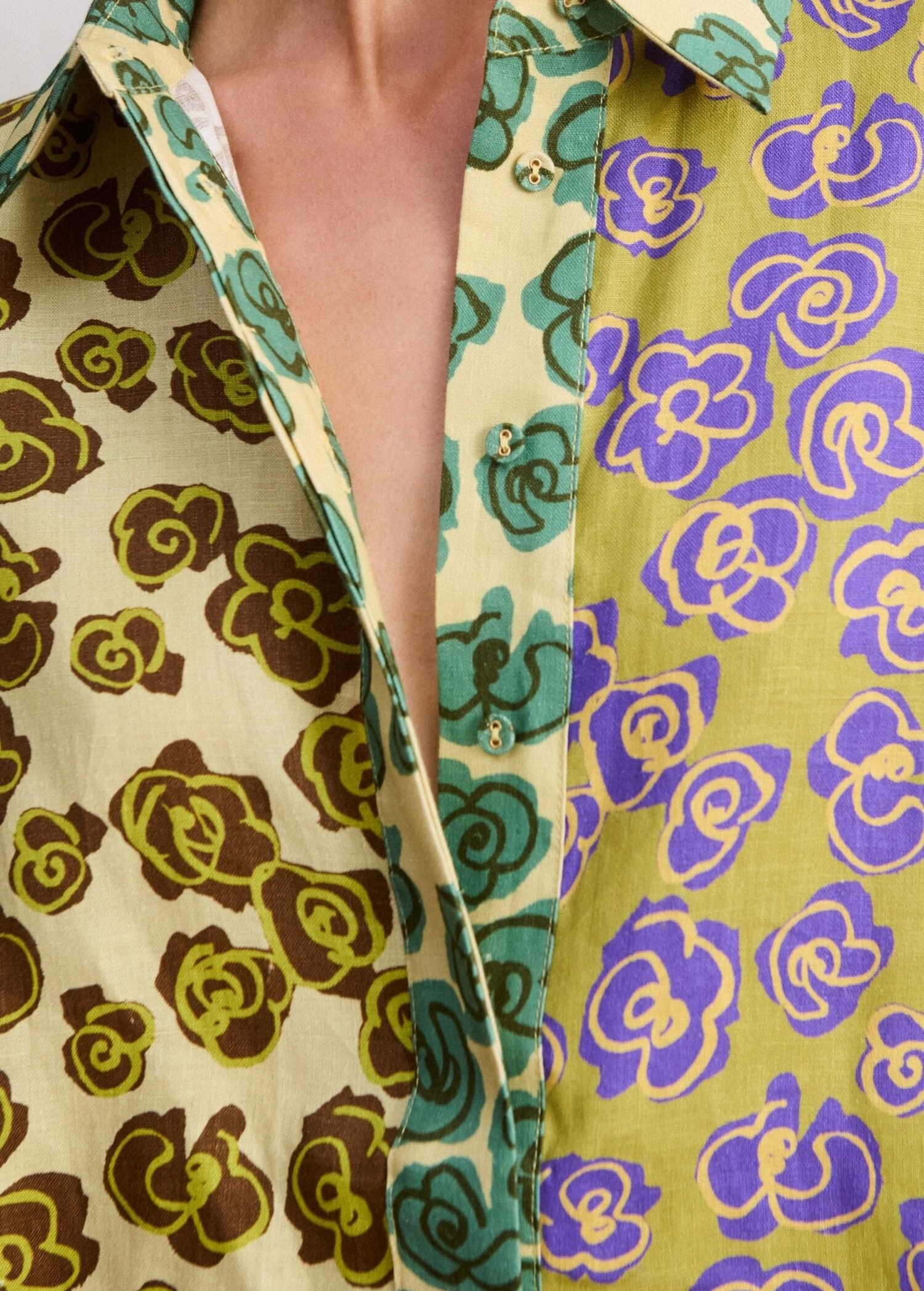 The Patty Shirt features an artistic, color-blocked floral print in shades of lime green, brown, teal, and purple.