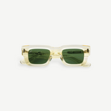 KABE SHOP INC Ares sunglasses featuring a thick translucent champagne frame and dark green lenses with Art Deco detail