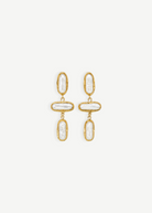 KABE SHOP INC Grace earrings featuring organic baroque pearls set in textured gold frames in a drop design.