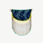KABE SHOP INC Verdi bag featuring blue patterned fabric with long, colourful beaded fringe and yellow accents.