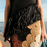 KABE SHOP INC Beep Beep mini skirt featuring hand-knit crochet circular motifs in earth tones on a boat deck