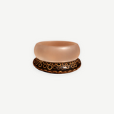 KABE SHOP INC wood and resin bangle set featuring a translucent resin band and a dark wood band with circle patterns.