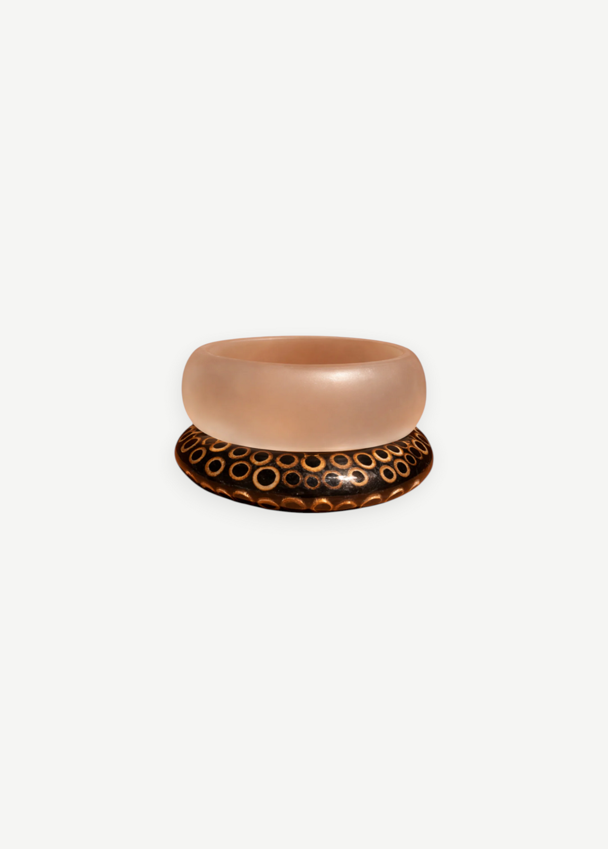 KABE SHOP INC wood and resin bangle set featuring a translucent resin band and a dark wood band with circle patterns.