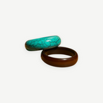 KABE SHOP INC resin bangle set featuring one turquoise crackle-patterned bracelet and one solid dark brown bracelet.