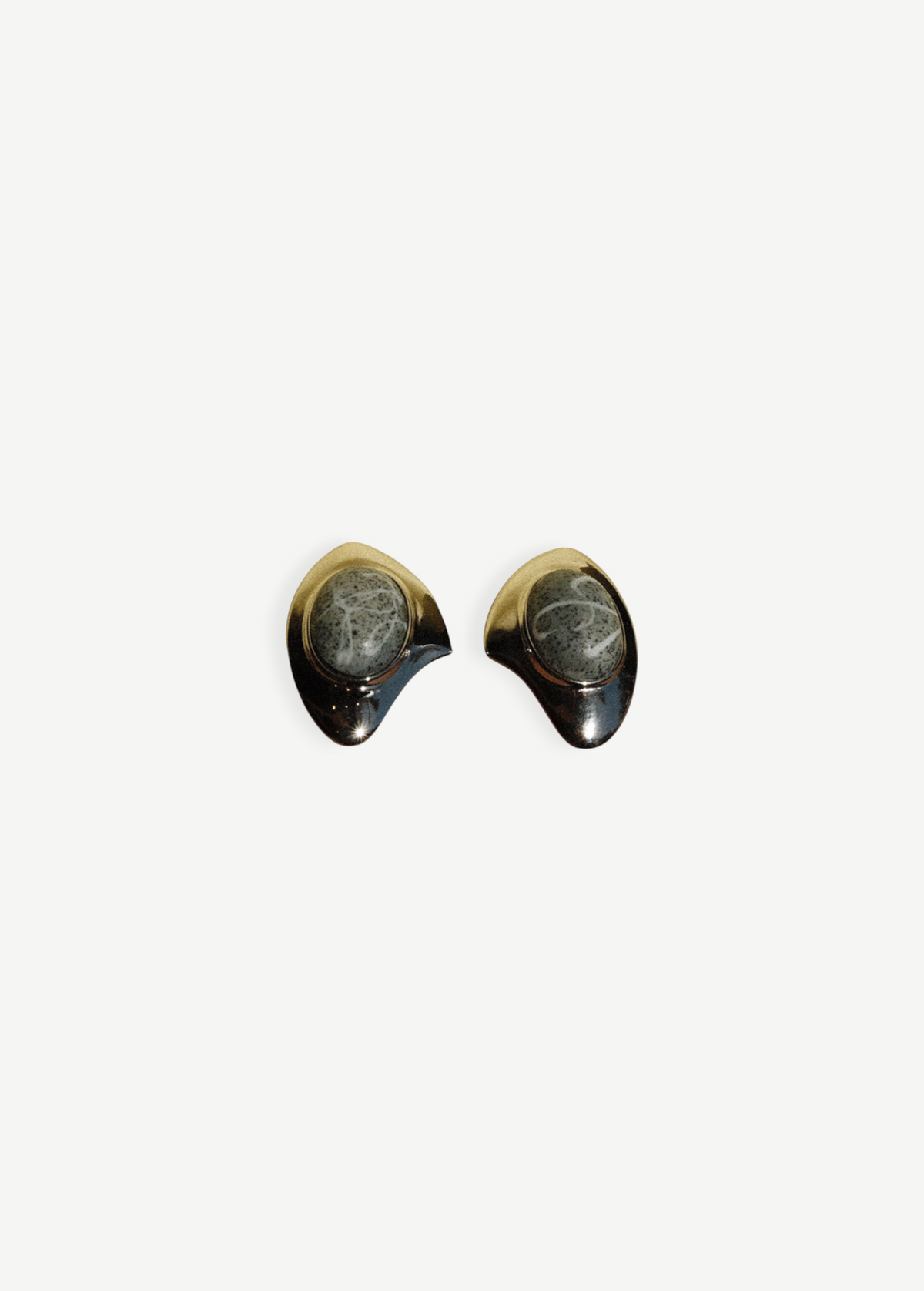 KABE SHOP INC geometric silver earrings featuring sculptural metal frames and detailed grey stone accents.
