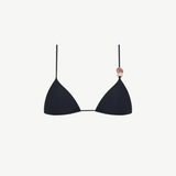 The Equator Top is a black triangle bikini top with a classic silhouette, made from eco-friendly recycled polyamide swimwear fabric. It features a pink and beige decorative bead on one strap and is shown against a plain white background.
