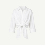 White Lisa Top featuring a collared button-down design, three-quarter length sleeves, a front tie waist, and a cropped silhouette ideal for high-waisted bottoms.