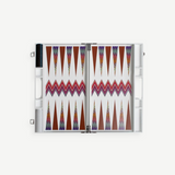 The ZigZag Backgammon Board Game features vibrant triangle patterns and comes complete with checkers stored on one side and dice in view, all beautifully crafted from acrylic and neatly presented in a sleek white carrying case—an eye-catching accent for your coffee table, photographed against a clean white background.