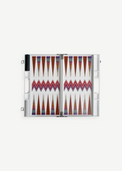 The ZigZag Backgammon Board Game features vibrant triangle patterns and comes complete with checkers stored on one side and dice in view, all beautifully crafted from acrylic and neatly presented in a sleek white carrying case—an eye-catching accent for your coffee table, photographed against a clean white background.