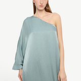 Model wearing KABE SHOP INC Sonia one-shoulder sage green maxi dress with a textured satin finish