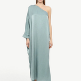 Model wearing a KABE SHOP INC Sonia one-shoulder sage green maxi dress with a relaxed, elegant silhouette.
