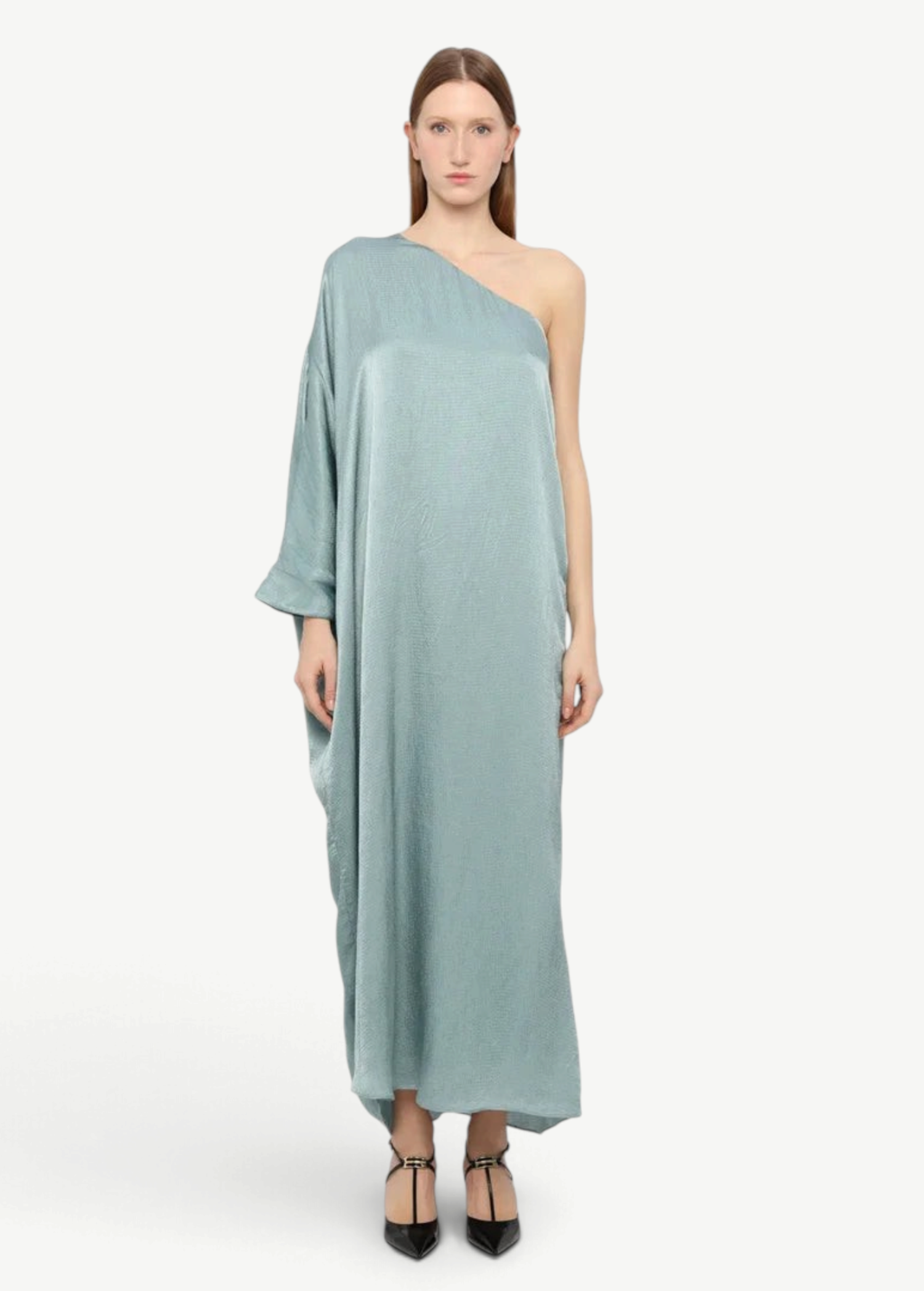 Model wearing a KABE SHOP INC Sonia one-shoulder sage green maxi dress with a relaxed, elegant silhouette.