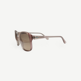 KABE SHOP INC vintage Carven sunglasses with translucent pink frames and brown gradient lenses, side view.