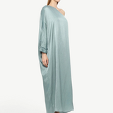 KABE SHOP INC Sonia one-shoulder maxi dress in shimmering light blue fabric worn by a model