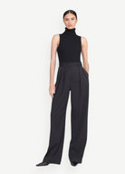 Model wearing KABE SHOP INC Luisa Pant in black with a high-waisted, wide-leg tailored silhouette.
