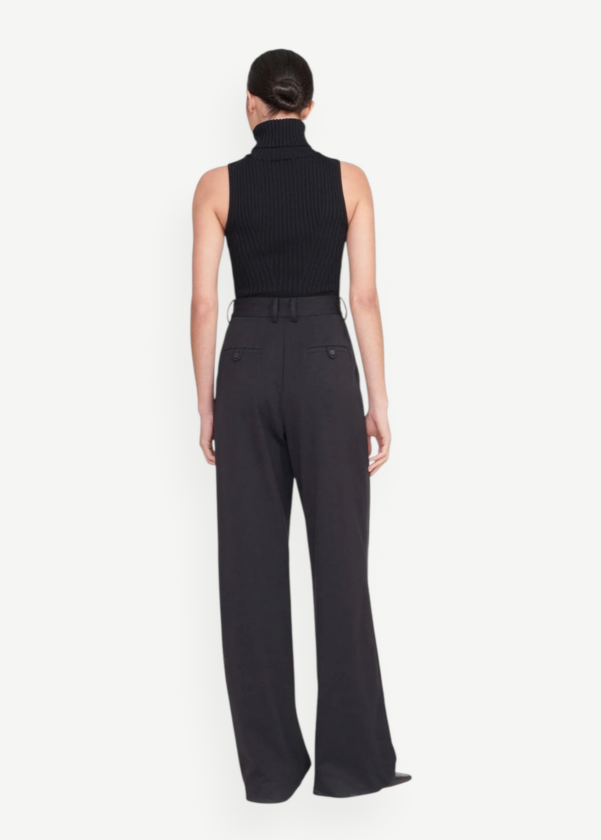 Back view of KABE SHOP INC Luisa Pant in black, featuring a tailored high-waisted silhouette and buttoned back pockets.