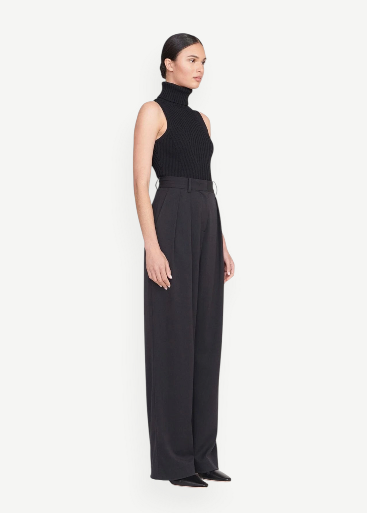 Model wearing KABE SHOP INC Luisa Pant, a high-waisted black tailored trouser with a wide-leg silhouette.