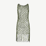 The Castaway Dress is a sleeveless macrame tunic dress crafted from green and black knotted netting with large diamond-shaped openings and long beaded fringe at the hem, handmade in Peru.