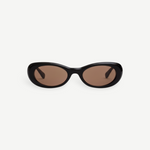 KABE SHOP INC Naomi sunglasses featuring an exaggerated black oval cellulose acetate frame and tinted lenses.